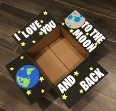 an open cardboard box with the words i love you to the moon and back