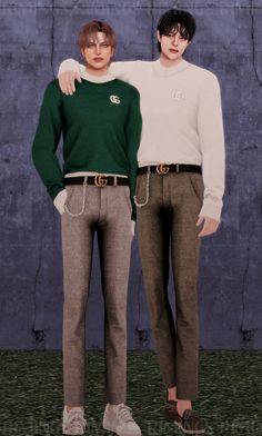 two young men standing next to each other in front of a blue wall wearing green and white sweaters