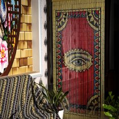 a living room with a couch and rugs on the floor