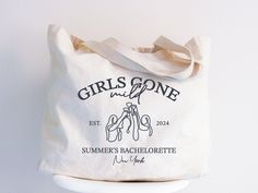 a white tote bag with the words girls gone on it and two hands holding each other