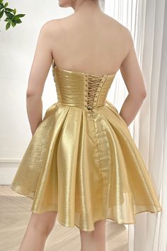 This elegant light gold dress will make you stand out at any event! The corset strapless design provides a flattering silhouette while the bow adds a charming touch. Look and feel confident in this stunning dress, perfect for any special occasion. Bust and Skirt with full lining. 100% Polyester 100% Recycled polyester lining Concealed zip at center back Imported Light Gold Dress, Patterned Bridesmaid, Princess Fantasy, Gold Tea, Golden Dress, Prom Party, Tea Length, Summer Accessories, Gold Dress