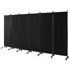 four black partitions with wheels on each side