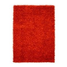 a red rug on a white background