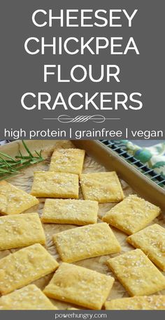 cheesey chickpea flour crackers on a cutting board with rosemary sprigs