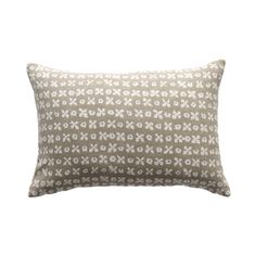 a white and grey pillow with an abstract design