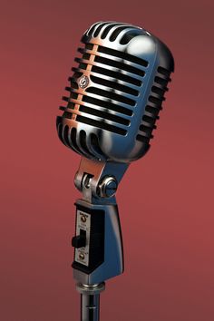 an old fashioned microphone is shown against a red background