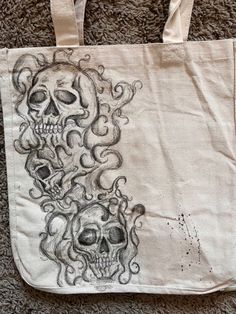 a tote bag with two skulls on it