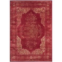 a red area rug with an ornate design on the center and bottom part of it