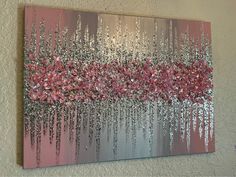 a painting with silver and pink flowers on it