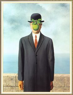 a man in a suit and hat with an apple on his face