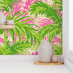 a kitchen with pink and green tropical wallpaper