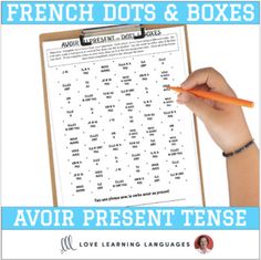 the french dots and boxes activity book is shown with a hand holding a pencil in front of it