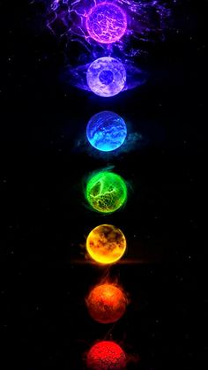 the seven chakras are lit up in different colors and sizes, with their reflection on