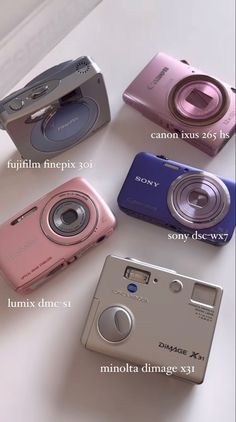 four different types of digital cameras sitting next to each other