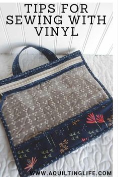 a handbag sitting on top of a bed with the words tips for sewing with vinyl