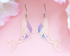 These light-weight holographic acrylic celestial whale earrings are the perfect statement earrings to add an extra pop to your outfit! Acrylic is very lightweight so you can enjoy large, statement earrings comfortably all day. ♡ Made with holographic iridescent acrylic ♡ Size: Approximately 3.25 inches in length measured from earring hook ♡ Earring hook is made from surgical stainless steel ♡ Care Instructions: ♡ - To clean: Wipe with a microfiber cloth to remove any dust - Avoid contact with pe Whale Earrings, Witchy Earrings, Iridescent Acrylic, Lightning Bolt Earrings, Acrylic Jewelry, Bold Earrings, Acrylic Jewellery, Celestial Jewelry, Funky Jewelry