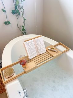 a bath tub with an open book on it