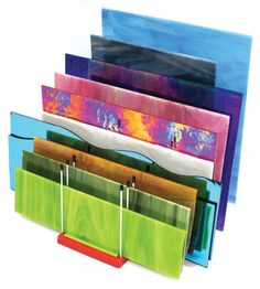 several different colored folders stacked on top of each other