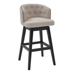 an upholstered bar stool with buttons on the back and arms, in beige fabric