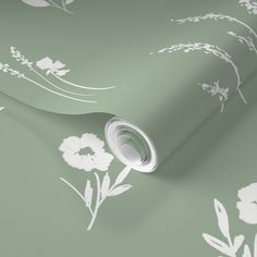 a green wallpaper with white flowers on it