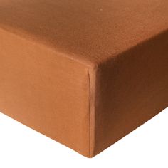 a brown sheet that is on top of a white surface with no sheets in it