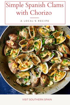 a bowl filled with clams and topped with parsley