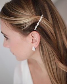 So sweet! Our Petite Pearl Bobby Pins are hand wired with small and medium sized off-white pearls. This petite pin is perfect for bridesmaids & flower girls too. Made with pearl beads. Measures 2 x .25 inches. Sold in sets of 2. Bobby Pin is wired to the back of the design. Style #2869 Pearl Bobby Pins, Hair Pinned Back, Silver Bobby Pins, Pearl Hair Pin Wedding, Bridal Hair Pins Pearl, Bobby Pin Hairstyles, Bridesmaid Pearls, Crystal Hair Pins, Bridal Hair Clip