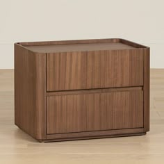 a wooden cabinet sitting on top of a hard wood floor