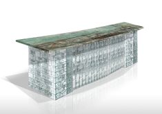 an artisticly designed bench made out of glass blocks and metal bars, on a white background