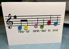 a card with music notes and buttons on it that says, happy birthday to you