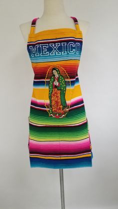 a colorful mexican dress on a mannequin with the word mexico printed on it