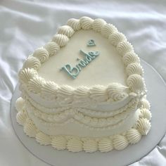 a white cake with the words happy birthday written on it