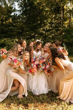 a group of bridesmaids posing for a photo together