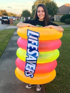 a woman holding an inflatable life saver