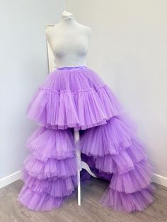 a mannequin wearing a purple tiered skirt