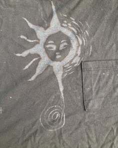 the sun and moon are drawn in white on a gray shirt with an inner pocket