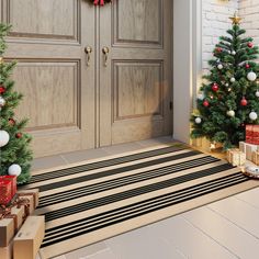 two christmas trees in front of a door with presents on the floor next to it