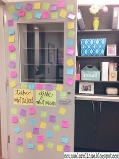 a door decorated with post it notes and magnets