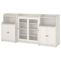 three white bookcases with doors and shelves