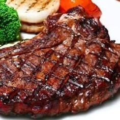 steak, broccoli and potatoes on a white plate