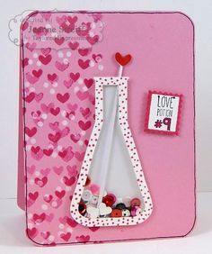 a valentine's day card with a pink background and a white vase filled with hearts