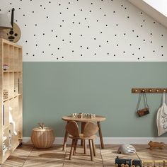 a child's room with green walls and white polka dot wallpaper on the ceiling