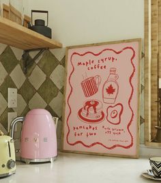 a pink toaster sitting on top of a counter next to a sign that says maple syrup coffee