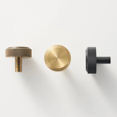 three different types of knobs on a white wall