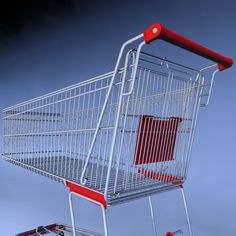 a silver shopping cart with red handles