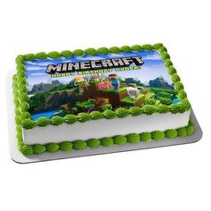 a birthday cake with an image of a minecraft character on the front and green frosting