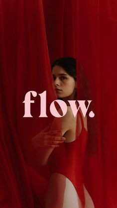 a woman standing in front of a red curtain with the word flow over her face