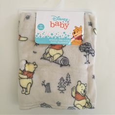 a baby blanket with winnie the pooh on it