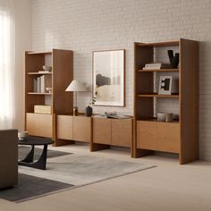 a living room filled with furniture and a white brick wall in the backround