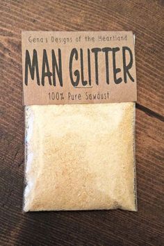 a bag of man glitter sitting on top of a wooden table